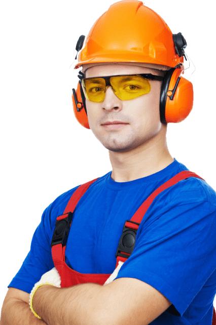 Worker wearing safety gear and overalls.